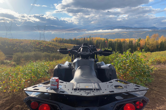 Can-Am Renegade with Lucky 7 Motorsports metal rear rack overlooking a mountain trail