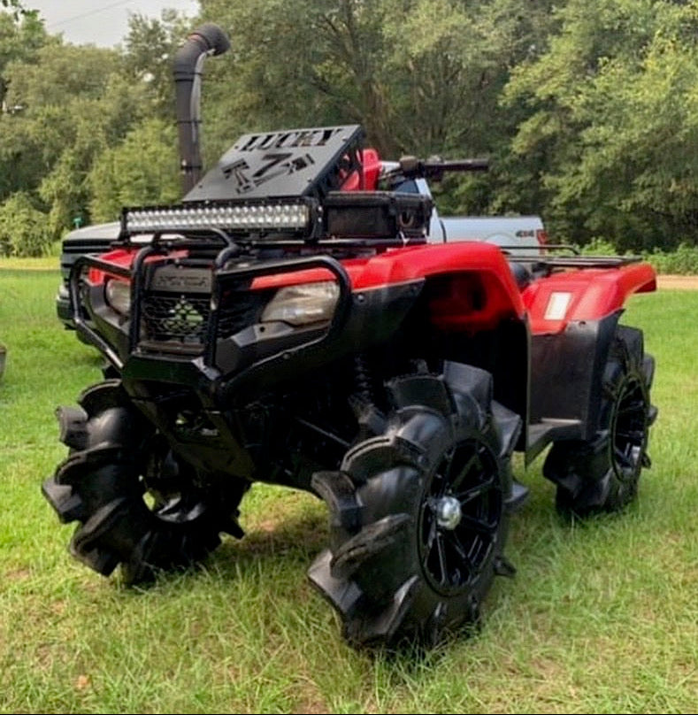Lucky 7 radiator relocation kit installed on Honda Rancher