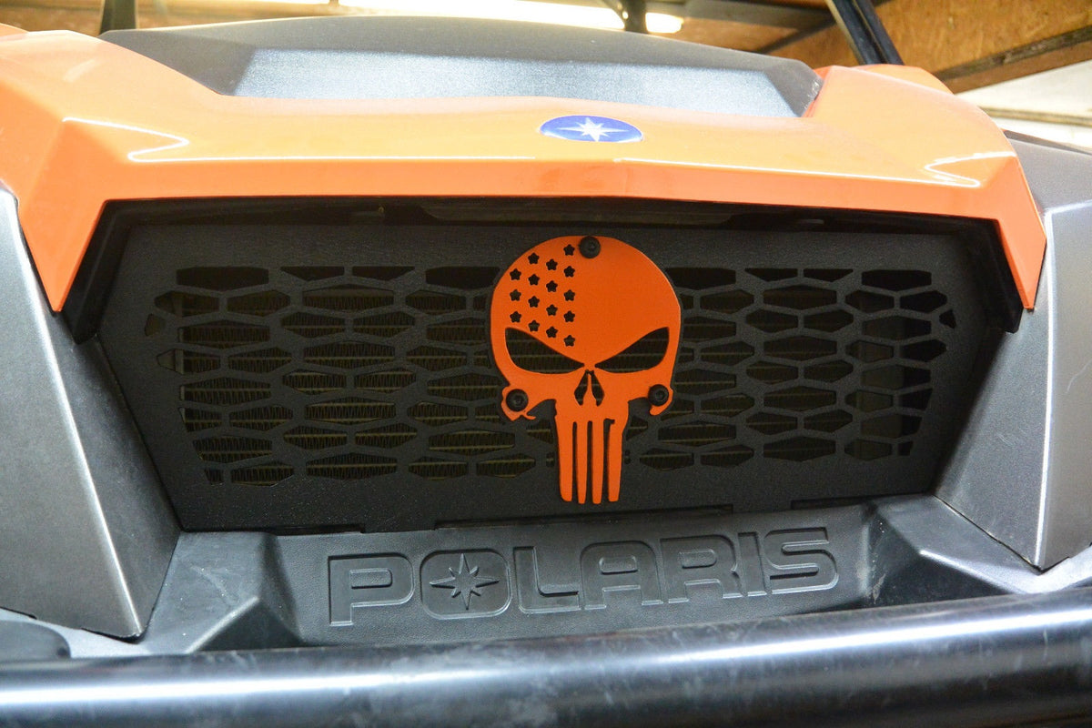 Close-up of orange Punisher Lucky 7 grille on a Polaris General 1000