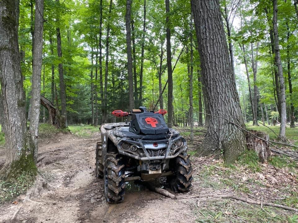 Lucky 7 2013-2024 Can-Am Outlander XMR Punisher BRP radiator relocate cover Orange installed on the trail
