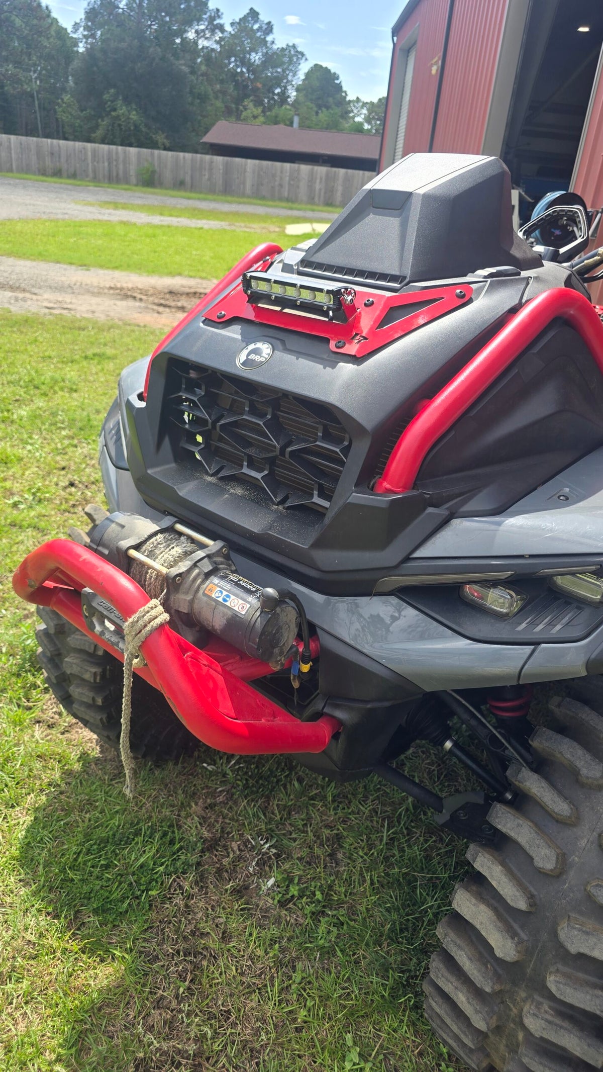 Lucky 7 2025 Can-Am Outlander XMR Gen 3 radiator cover LED Light Bar Legion Red angle view on the machine