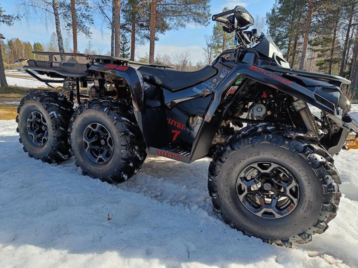 Can-Am Outlander 6x6 in snow with Lucky 7 metal floorboards
