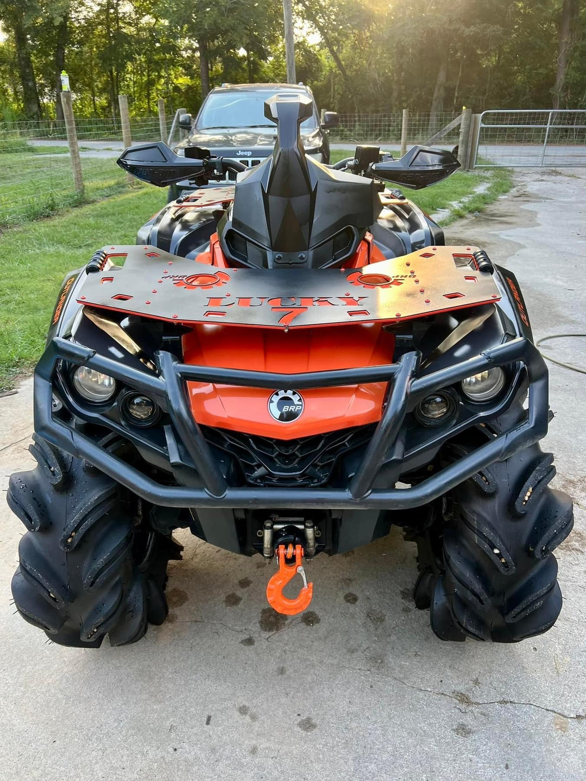 Lucky 7 front rack on an orange Can-Am Outlander G2