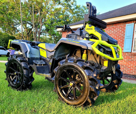 Lucky 7 extra-clearance floorboards on a yellow Can-Am Outlander G2 MAX