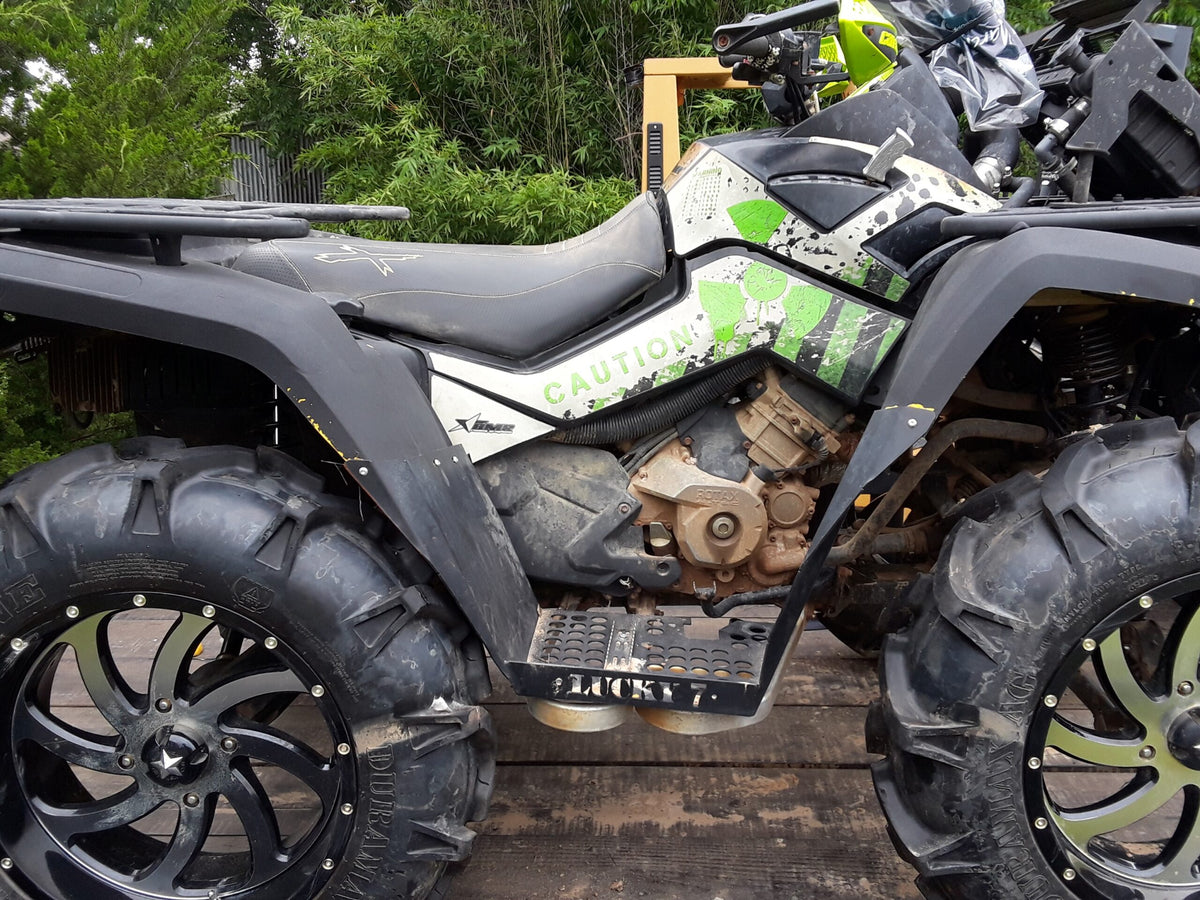 Side view of Lucky 7 metal floorboards on a Can-Am Outlander Gen 1 short frame