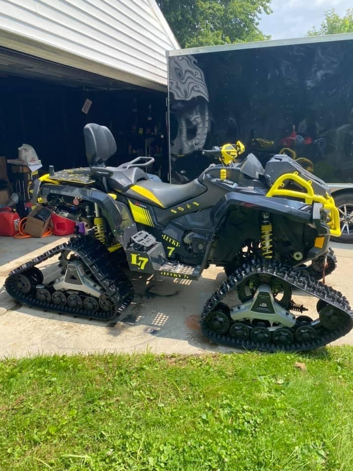 Can-Am Outlander Gen 2 Max on tracks with Lucky 7 metal floorboards
