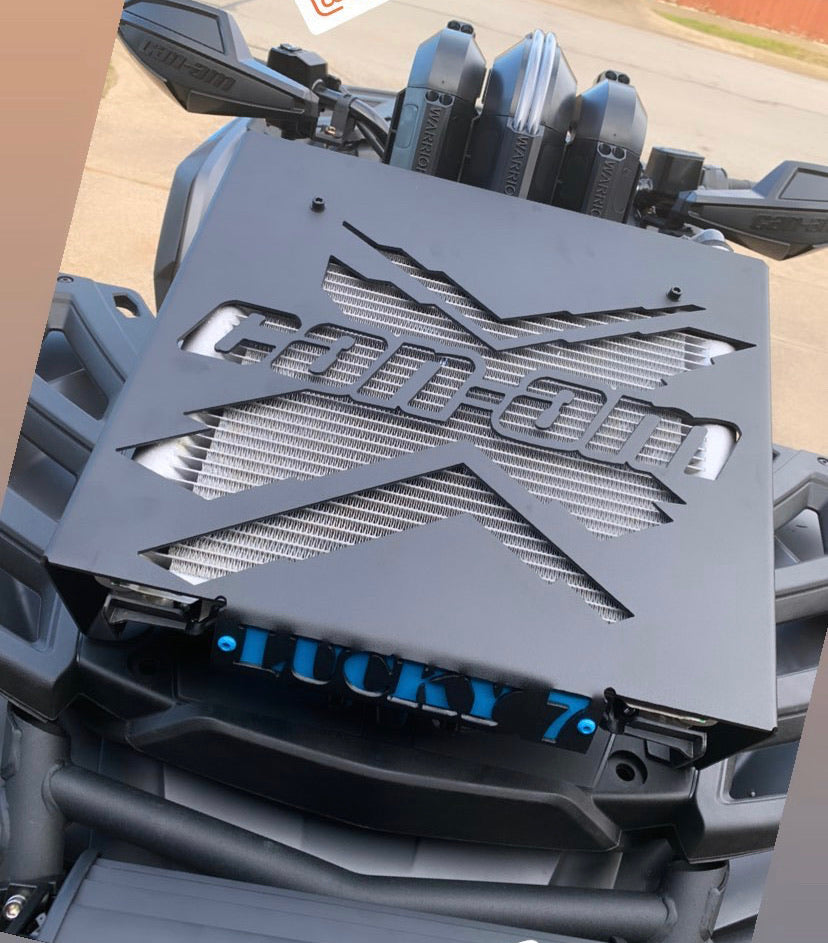 Close-up of Can-Am X Lucky 7 radiator relocate kit on an Outlander Gen 2
