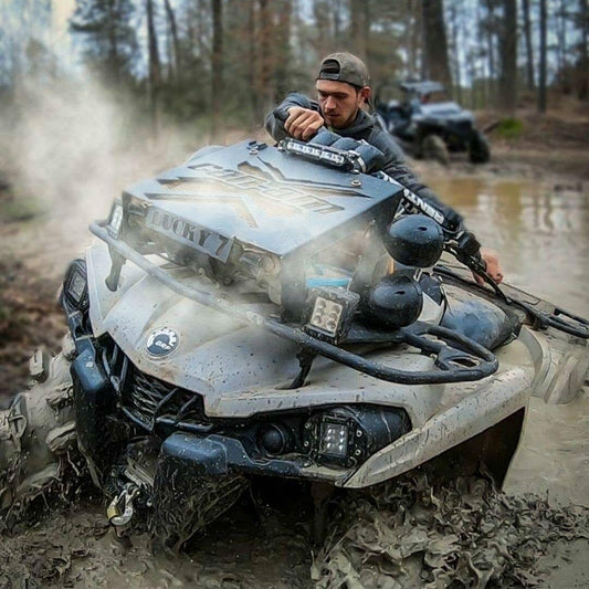 Lucky 7 radiator relocate kit on a Can-Am Outlander Gen 2 in the mud
