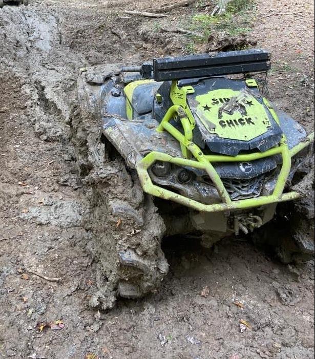 Custom Lucky 7 radiator relocate cover on a Can-Am Outlander MAX XMR in the mud