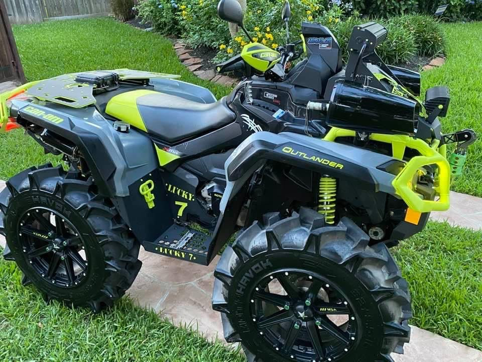 Yellow Can-Am Outlander with Lucky 7 metal floorboards