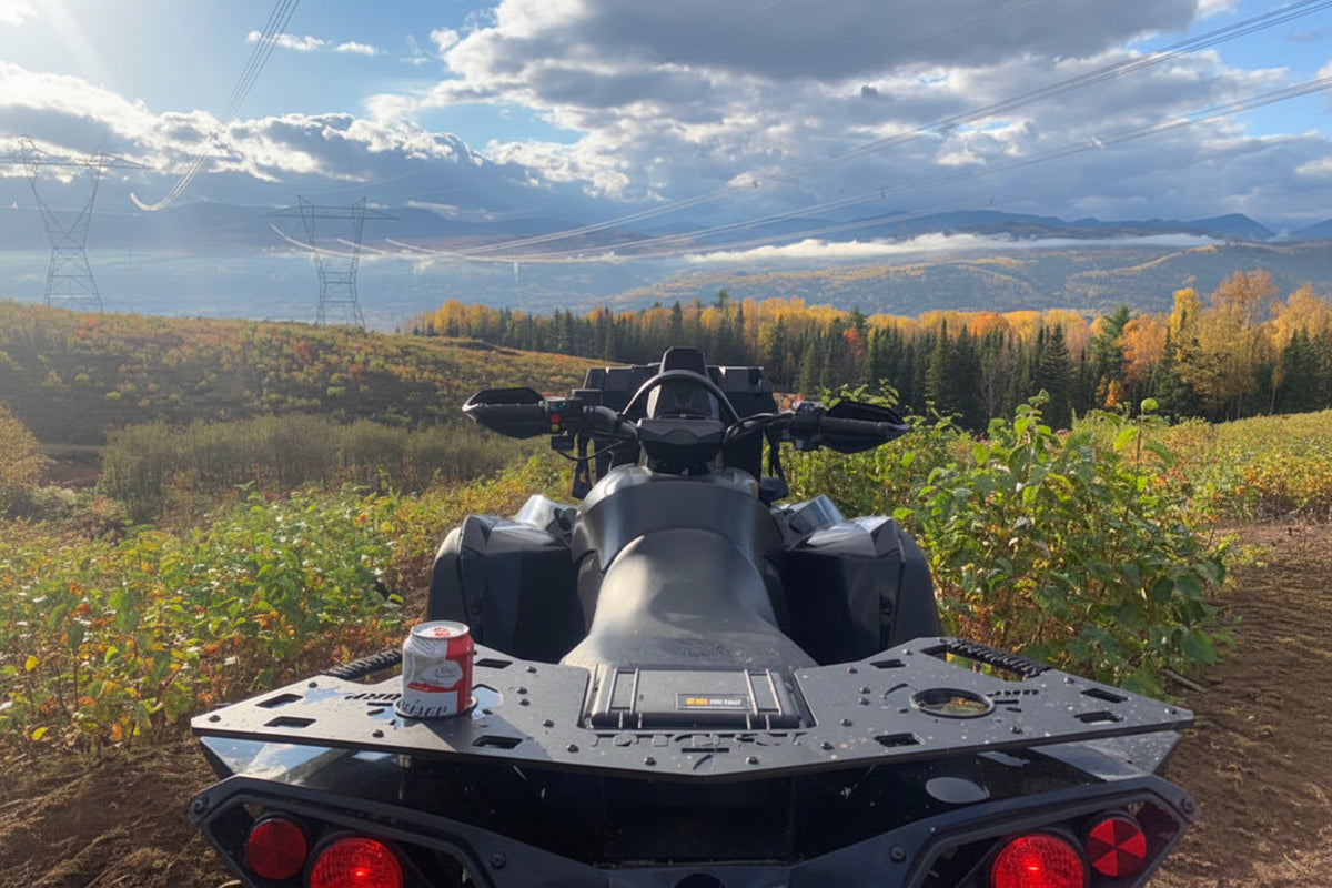 Can-Am Renegade with Lucky 7 Motorsports metal rear rack overlooking a mountain trail