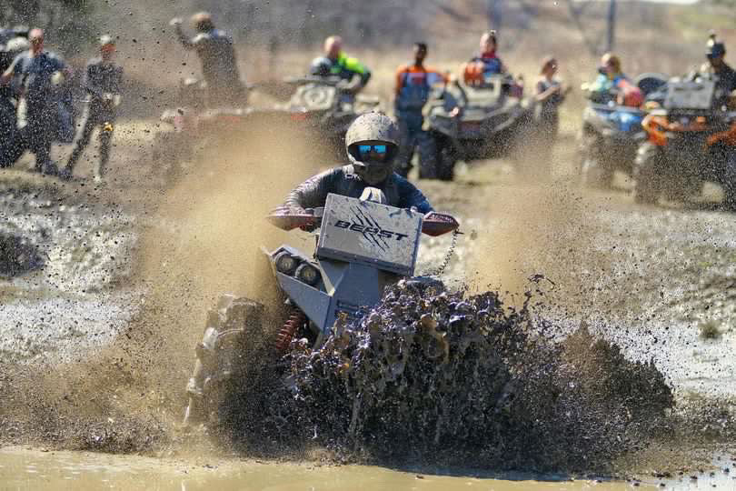 Lucky 7 Send It radiator relocate bumper on a Can-Am Renegade XMR in the mud