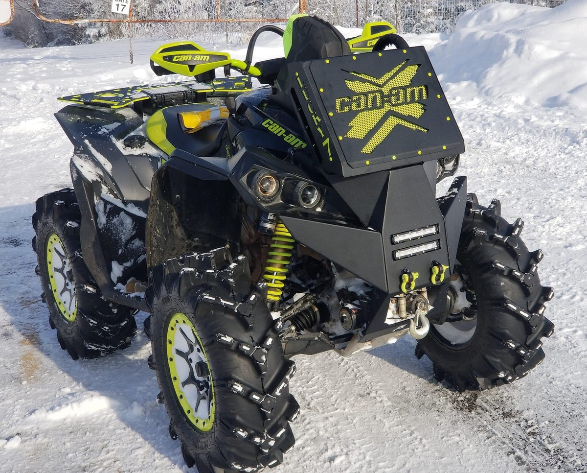 Yellow Can-Am X Lucky 7 radiator relocate bumper on a Renegade XMR in the snow