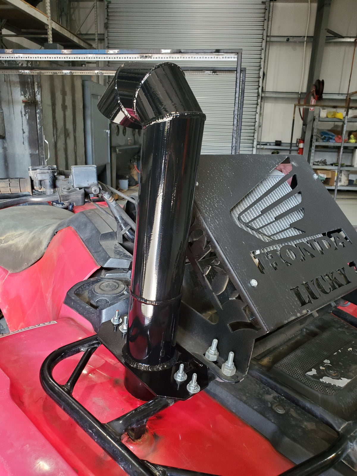 Lucky 7 aluminum snorkel kit installed on a Honda Foreman