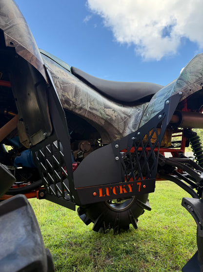 Texture Black Lucky 7 race cut floorboards with orange logo on a Kawasaki Brute Force