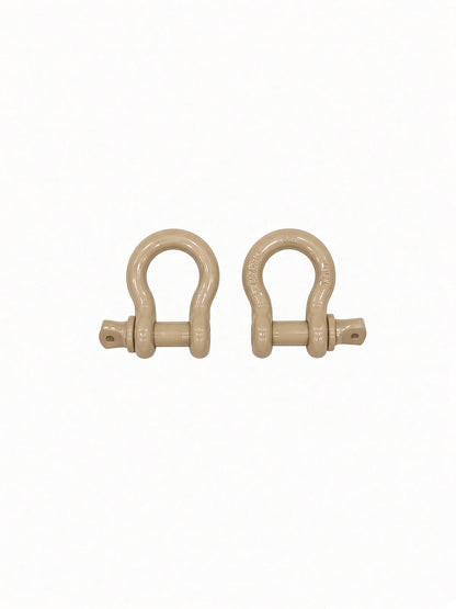 Pair of desert tan Lucky 7 shackles for the Can-Am Renegade XMR radiator relocate bumper
