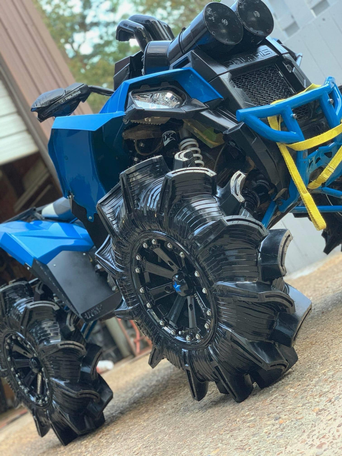 Front view of a Polaris Scrambler with a Lucky 7 2 inch lift kit