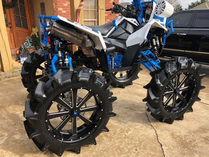 Side view of a Polaris Scrambler with a Lucky 7 2 inch lift kit