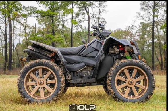 Polaris Scrambler on the trail with a Lucky 7 2 inch lift kit