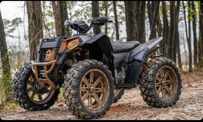 Polaris Scrambler in the woods with Lucky 7 metal floorboards