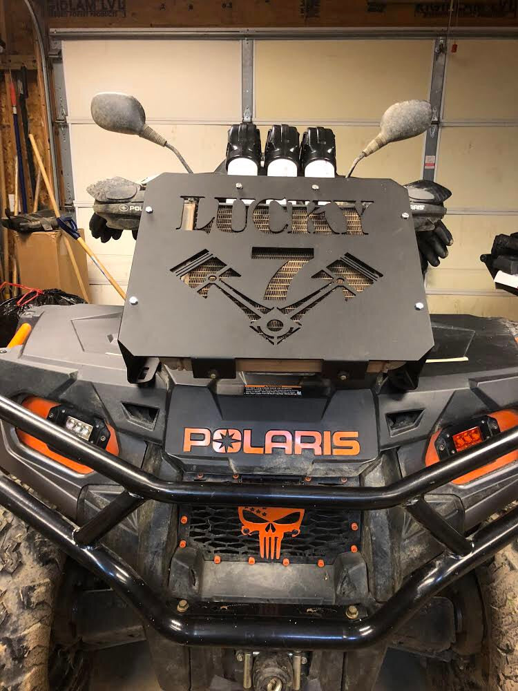 Lucky 7 design radiator relocate kit on a Polaris Sportsman