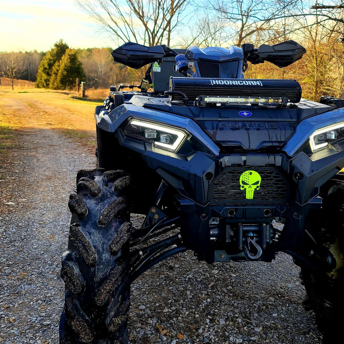Yellow Punisher Lucky 7 grille installed on a blue Polaris Sportsman 450 570