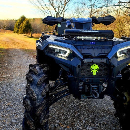 Yellow Punisher Lucky 7 grille installed on a blue Polaris Sportsman 450 570