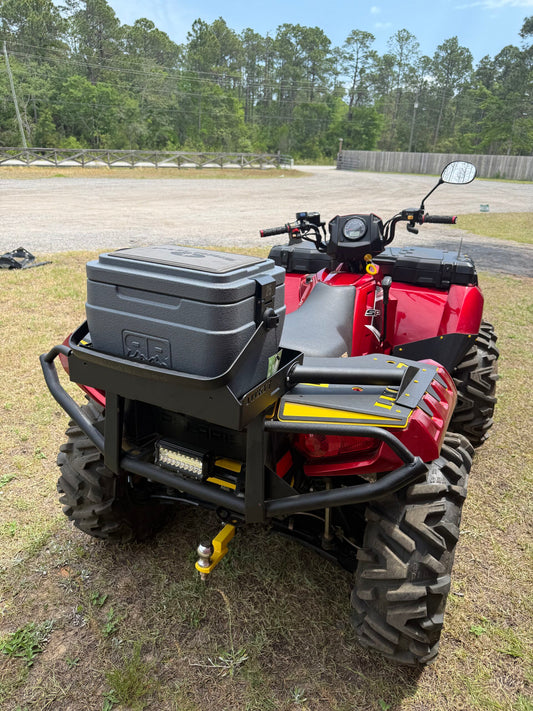 Polaris Sportsman with Lucky 7 cooler rack in front of the Milton shop