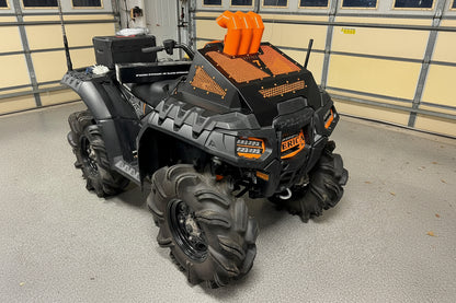 Orange Lucky 7 3 inch snorkel riser kit and radiator cover on a Polaris Sportsman High Lifter