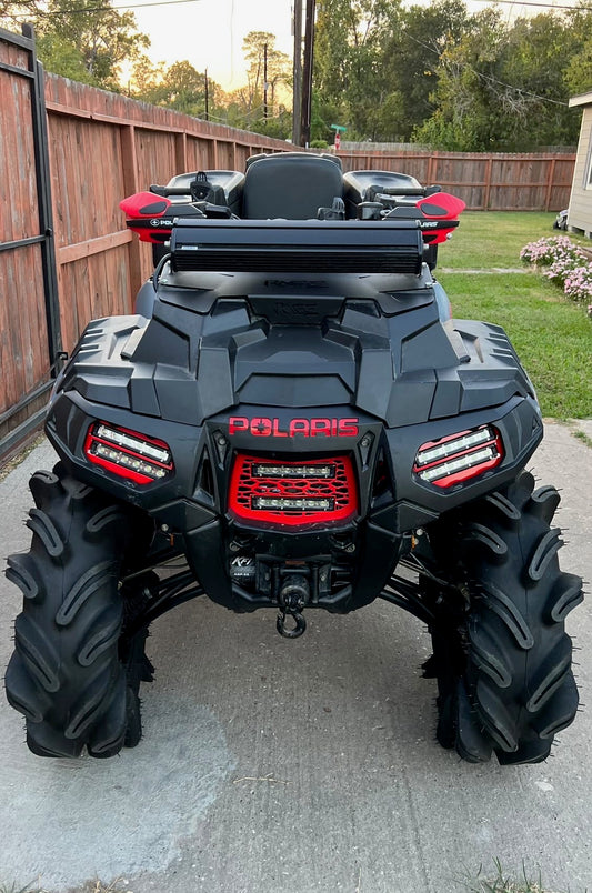 Red mesh Lucky 7 double LED grille on a Polaris Sportsman High Lifter