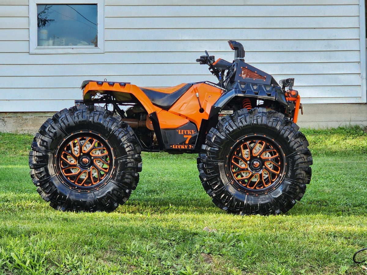 Orange Sportsman High Lifter with Lucky 7 metal floorboards