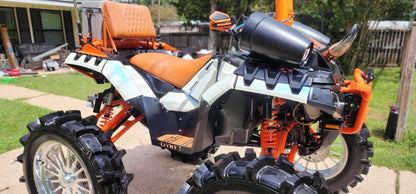 Side view of Lucky 7 metal floorboards on a Sportsman High Lifter
