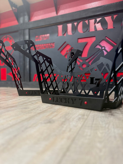 Close-up of Lucky 7 Motorsports Polaris Sportsman High Lifter Race Cut floorboards in Texture Black with red accents