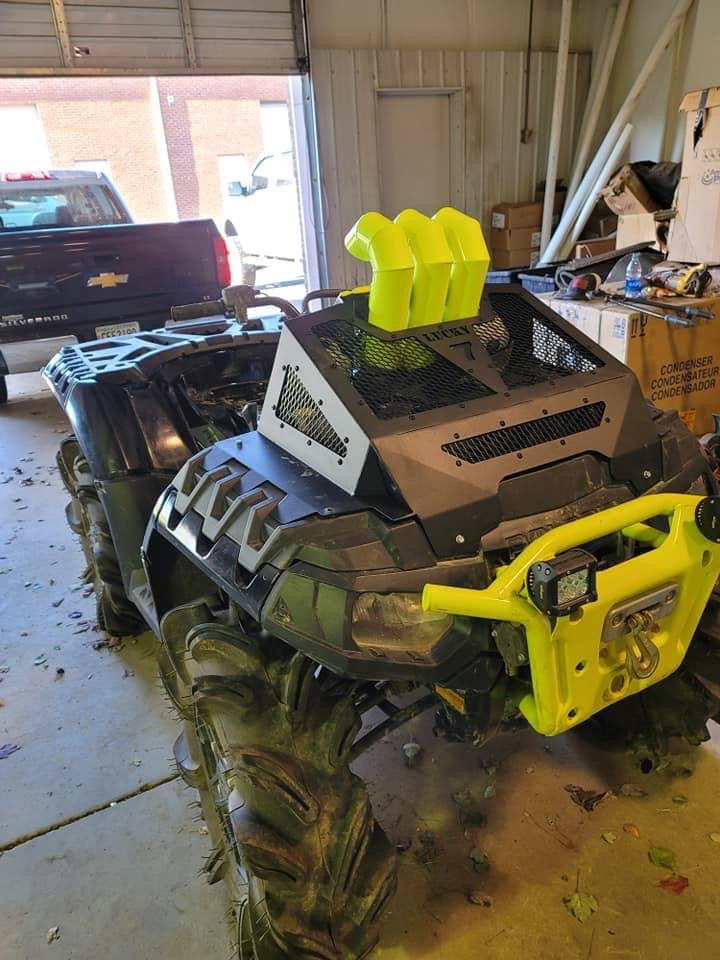 Lucky 7 radiator cover and snorkel risers installed on a Polaris Sportsman High Lifter