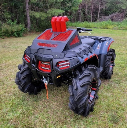 Red Lucky 7 radiator cover with snorkel on a Polaris Sportsman High Lifter