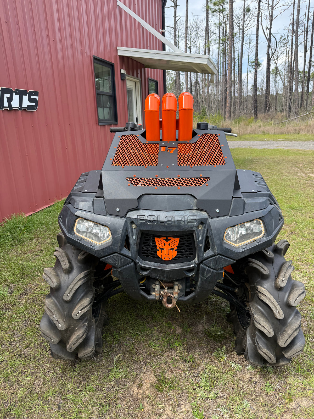 Orange Transformers Lucky 7 grille on a Polaris Sportsman High Lifter
