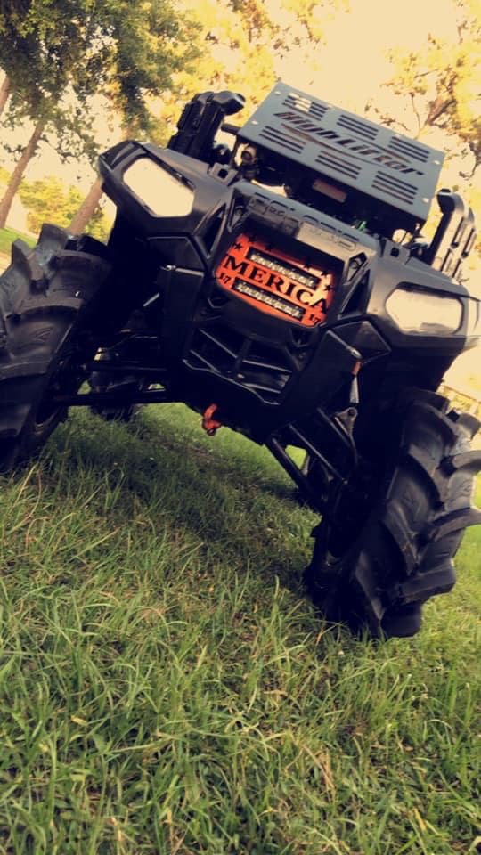 Polaris Sportsman with orange Merica double LED grille installed by Lucky 7 Motorsports