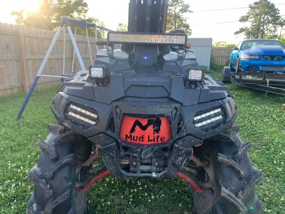 Polaris Sportsman with Indy Red Mud Life grille installed by Lucky 7 Motorsports