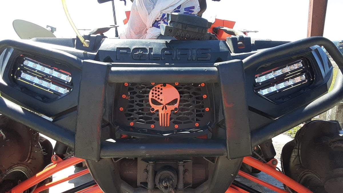 Polaris Sportsman with Indy Red Punisher grille installed by Lucky 7 Motorsports