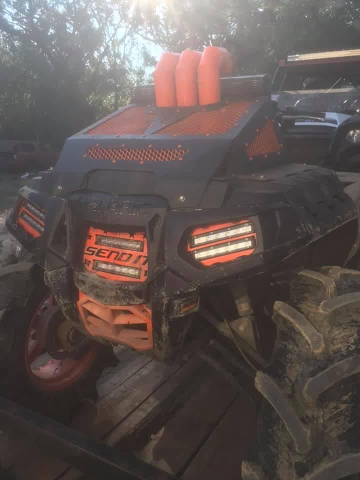 Polaris Sportsman with orange Send It double LED grille installed by Lucky 7 Motorsports