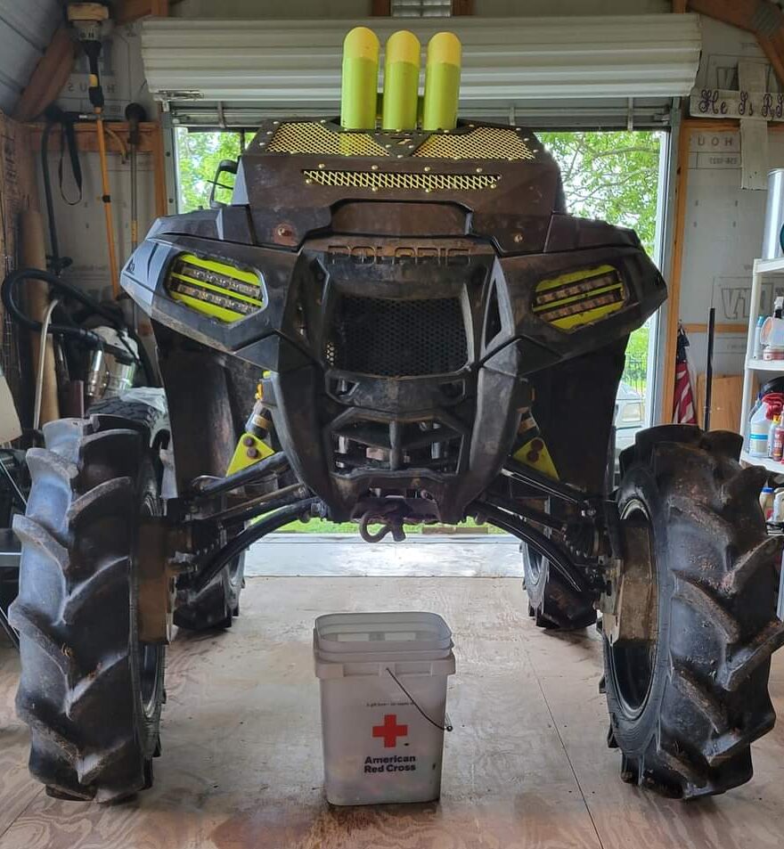 Polaris Sportsman with Lucky 7 lime slim row LED lights and yellow snorkels