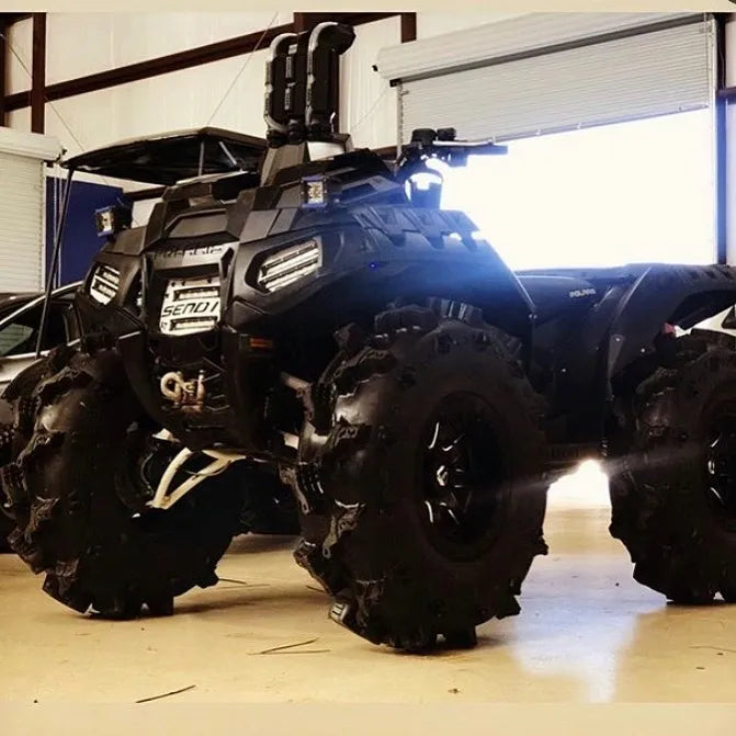 Polaris Sportsman in the shop with Lucky 7 dual slim row LED lights and Send It grille