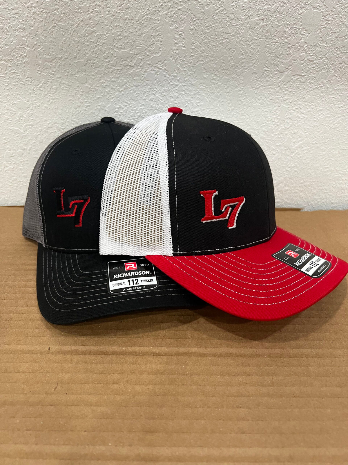 Richardson 112 Lucky 7 trucker hats in black/grey and red/black/white color options