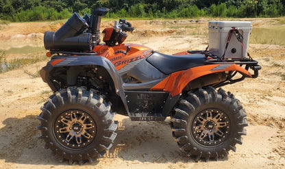 Orange Yamaha Grizzly with Lucky 7 high-clearance metal floorboards