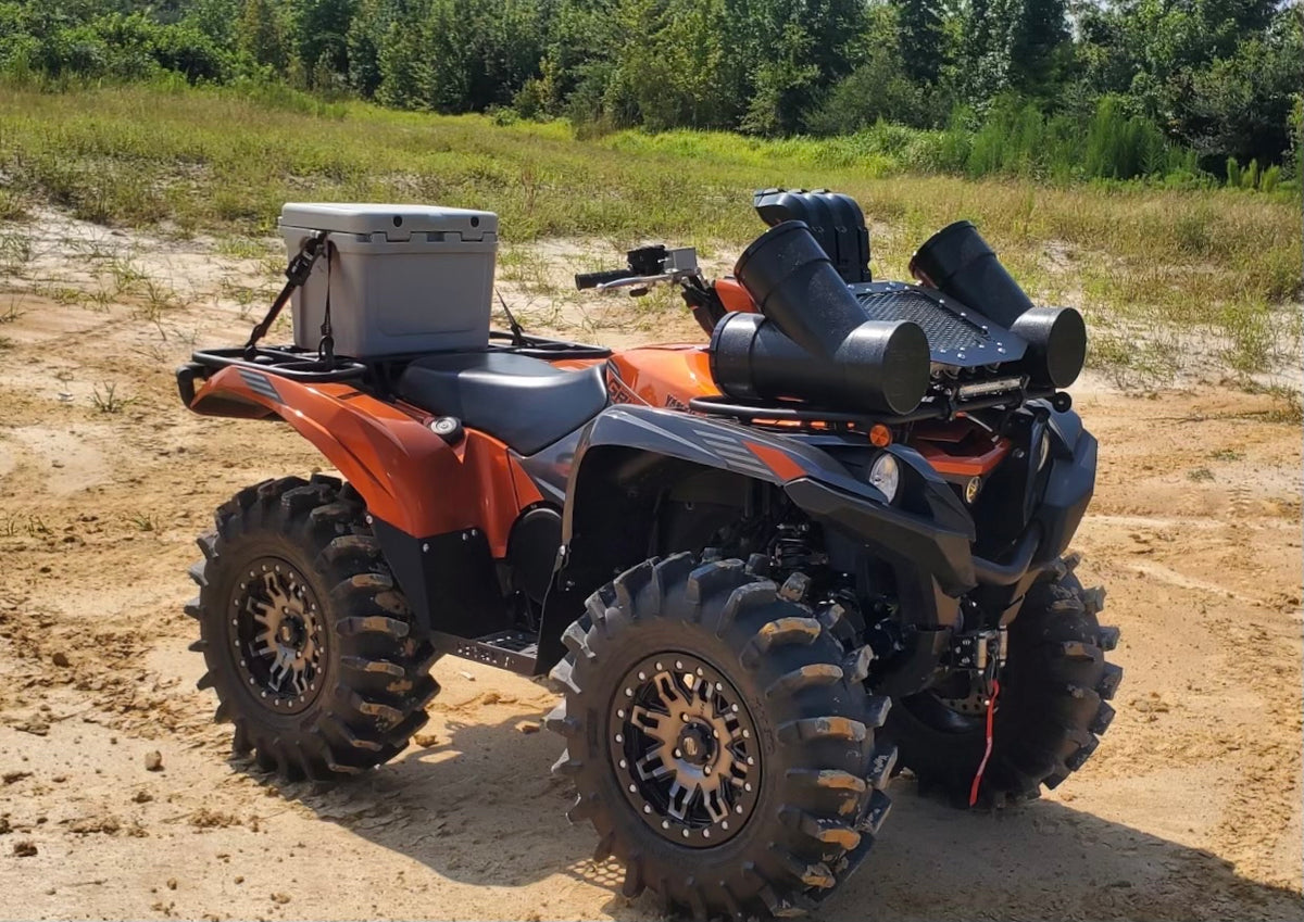 Lucky 7 Yamaha Grizzly Kodiak low profile mesh radiator relocation kit installed side view on an orange Grizzly