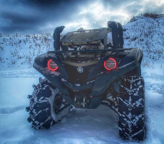 Lucky 7 Yamaha Grizzly Kodiak low profile mesh radiator relocation kit installed on a machine in the snow