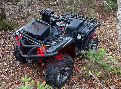 Lucky 7 Yamaha Grizzly Kodiak low profile mesh radiator relocation kit installed on a Grizzly in the woods