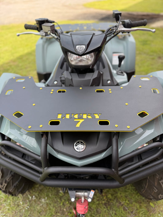Close-up of Lucky 7 Motorsports front rack on Yamaha Kodiak 450 - black powder coat with yellow LUCKY 7 lettering and accents